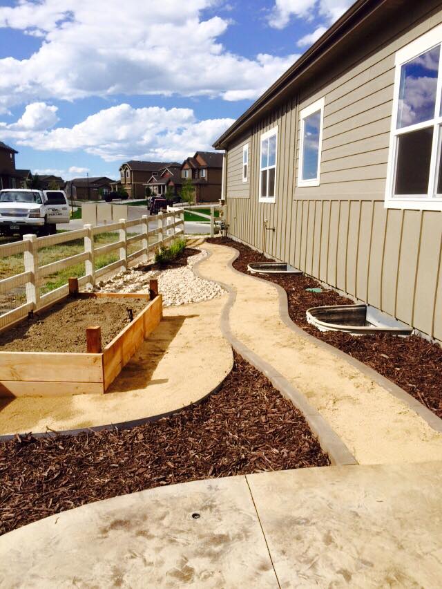 Artistic Escapes  simple contemporary functional wood garden raised bed planter boxes, creating a frame for the organic art created through plants EATON COLORADO landscape design landscape installation garden bed raised garden