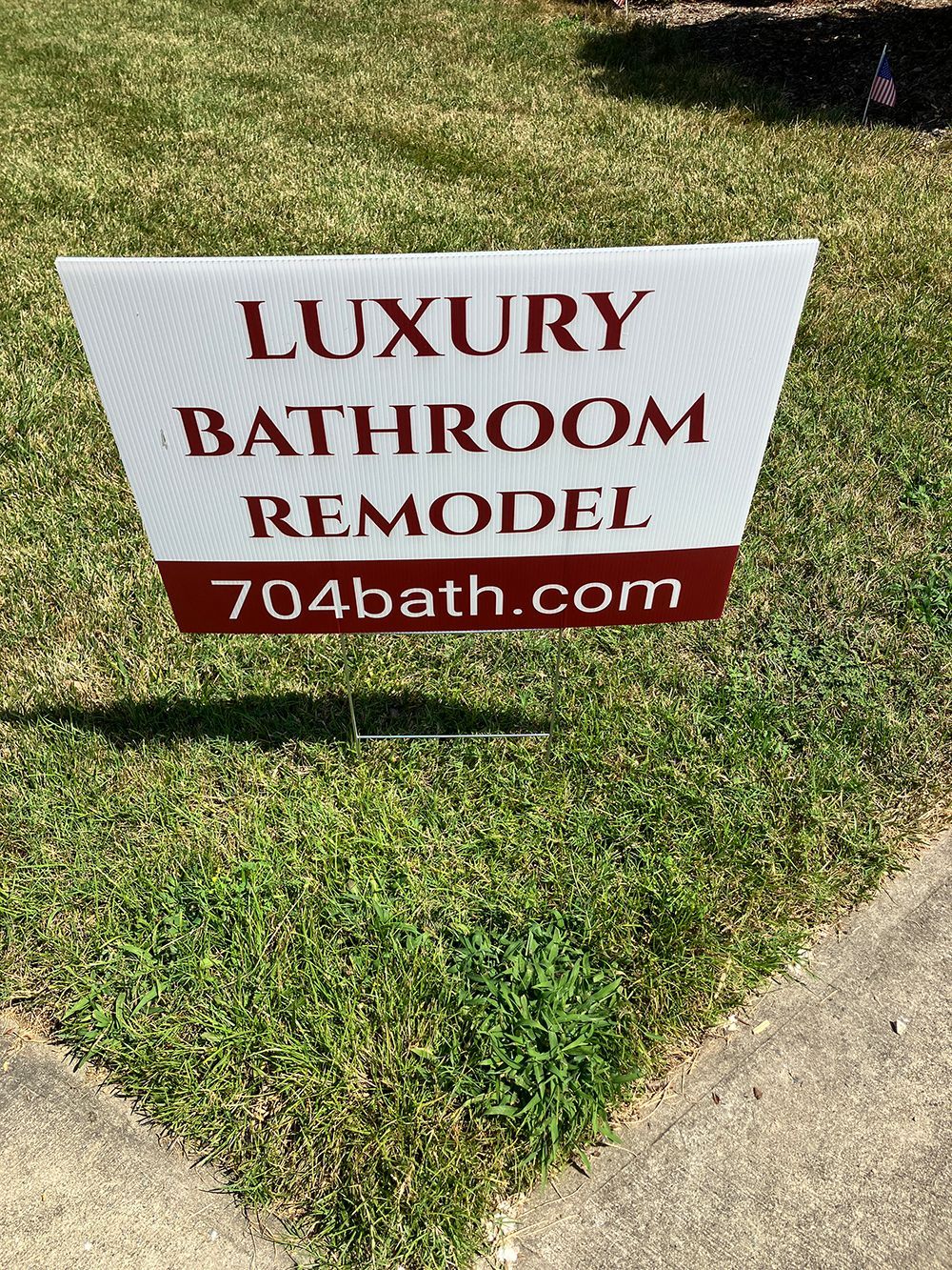 Sign on green grass: 