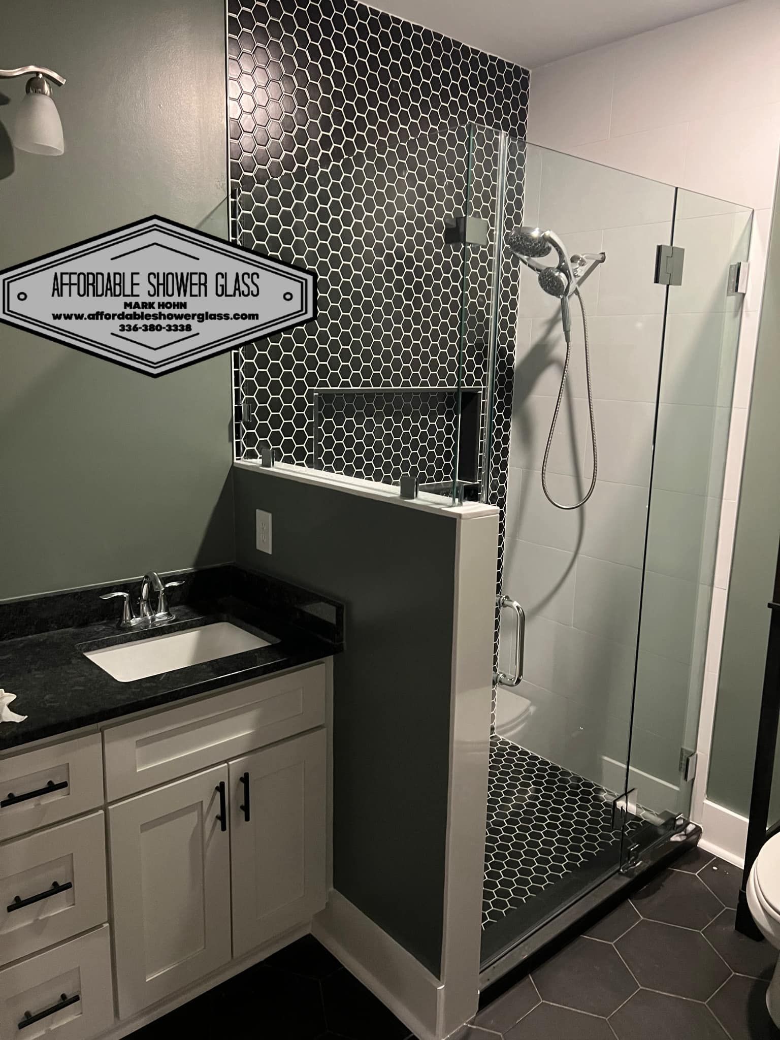 A bathroom with a walk in shower, sink, and toilet.