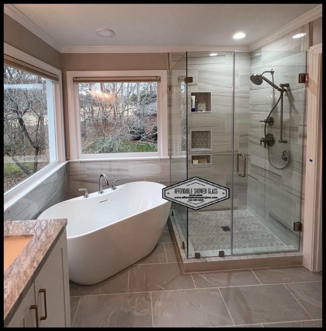 A bathroom with a bathtub and a walk in shower