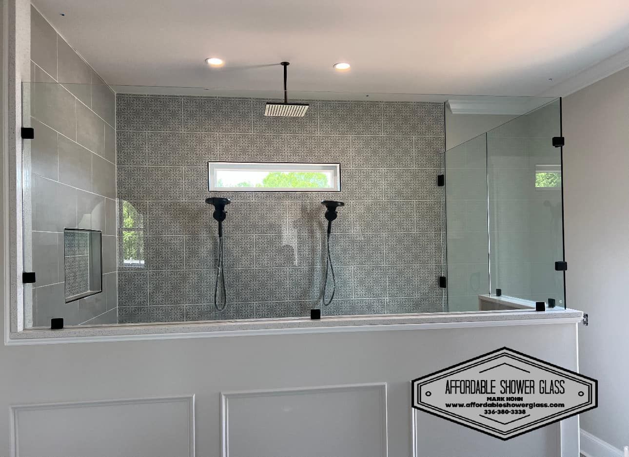 A bathroom with a walk in shower and a bathtub.