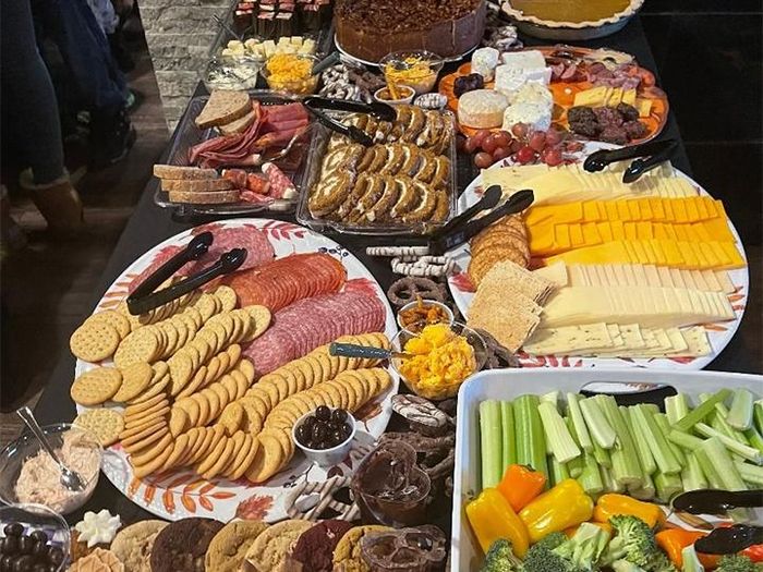 A table topped with plates of food and vegetables