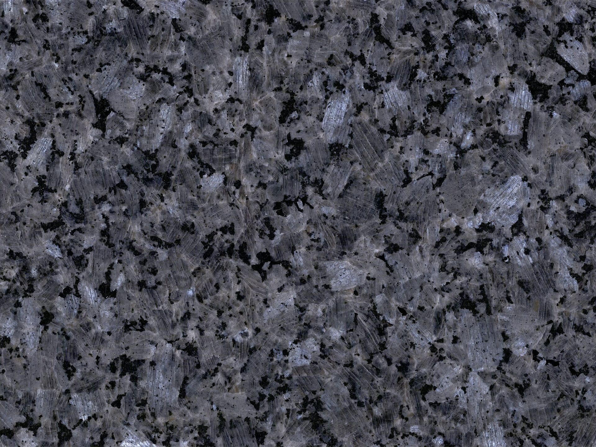 Dark blue granite with speckled patterns.