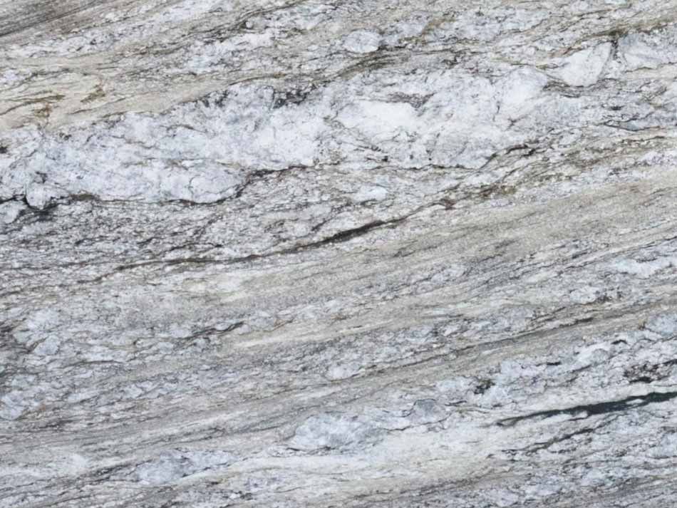Gray and white granite with dark veins and crystalline inclusions.