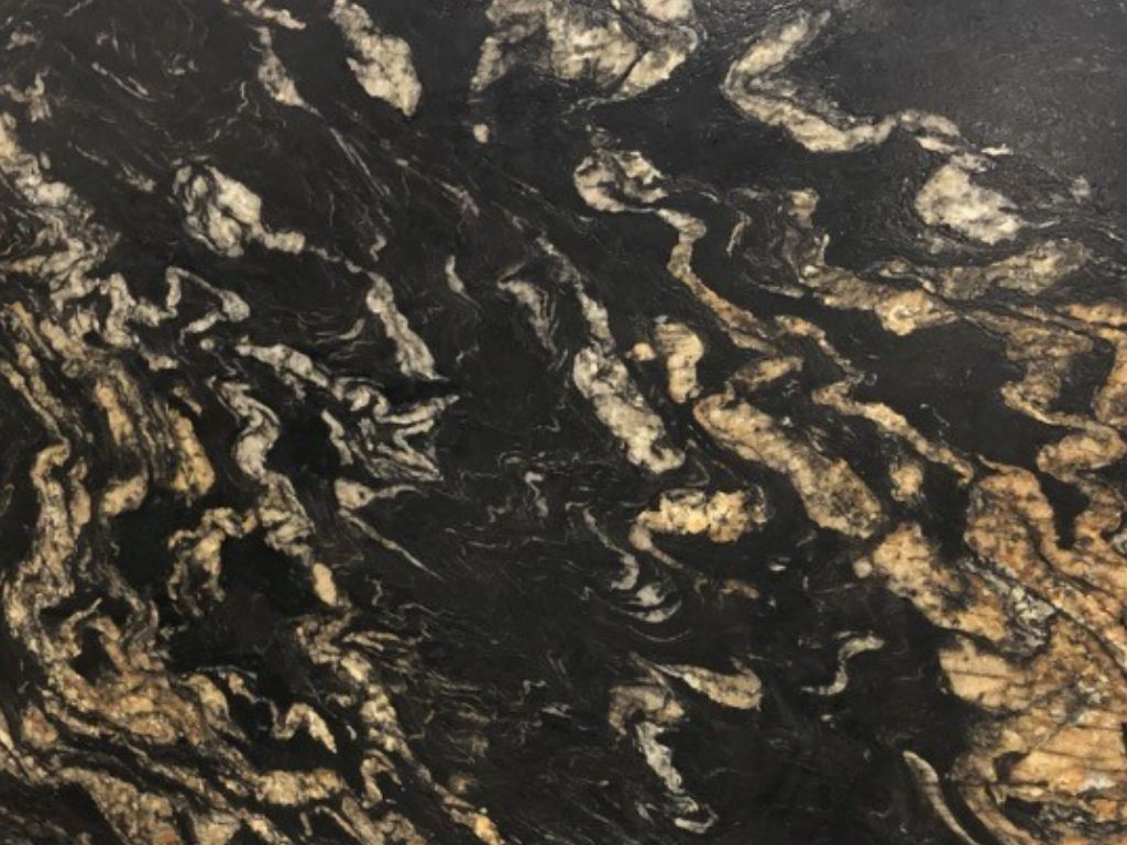 Black granite countertop with swirling gold and white patterns.