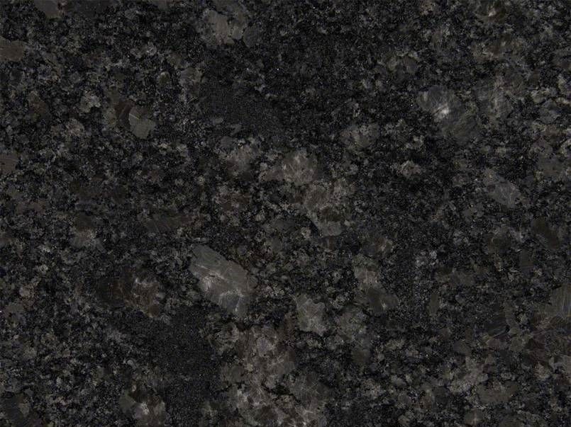 Close-up of a dark granite countertop with speckled gray and black patterns.