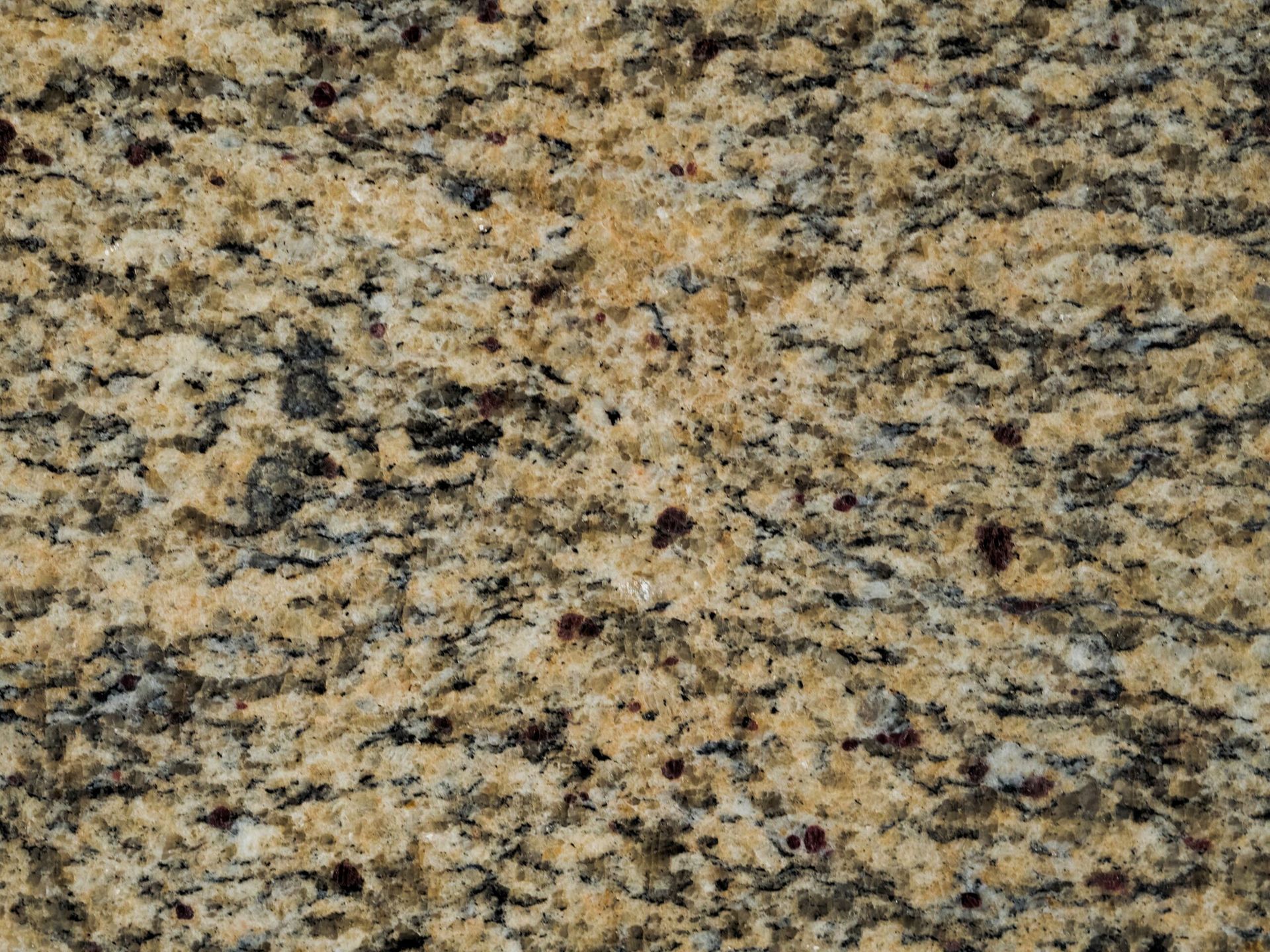 Yellow and black speckled granite countertop.
