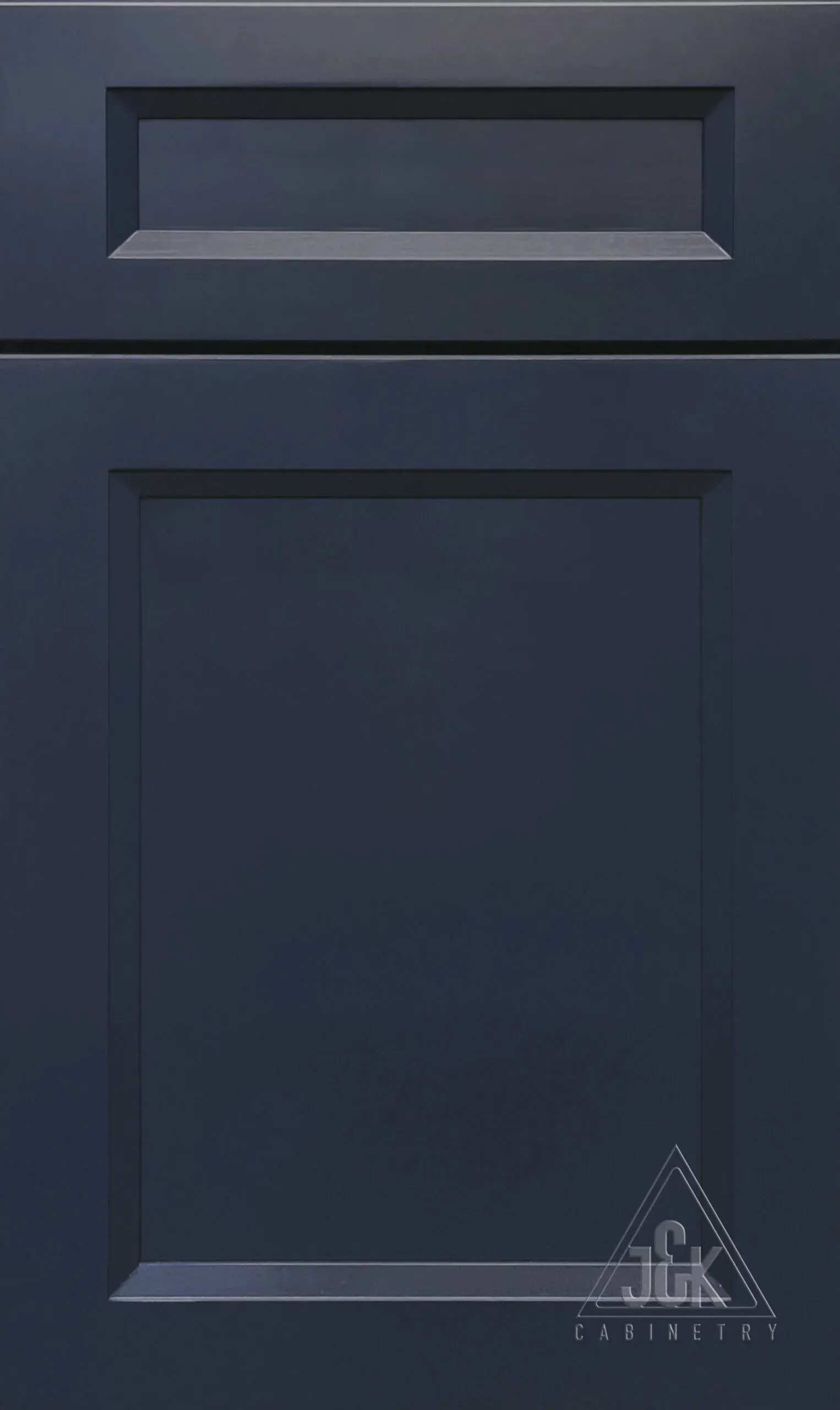 Dark blue shaker-style cabinet door with raised center panel and top molding.