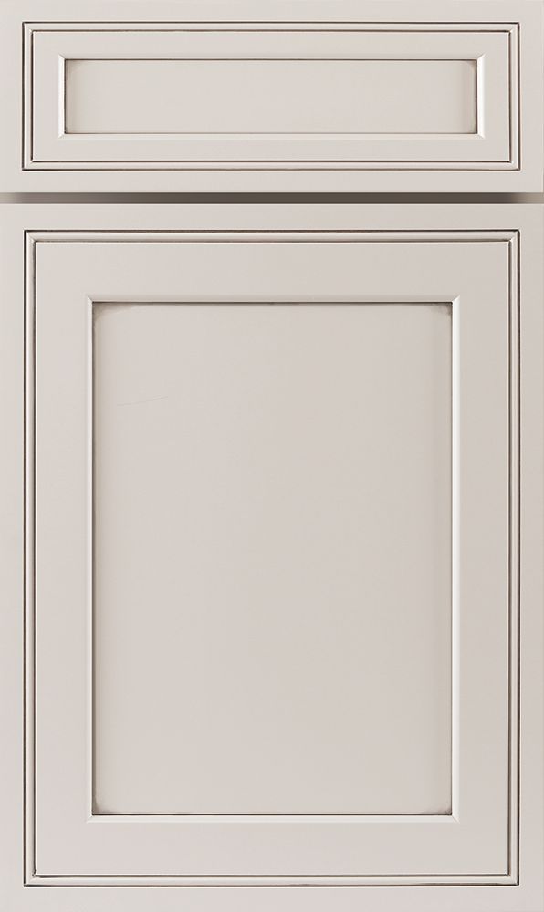 White cabinet door with recessed panel and small upper door.