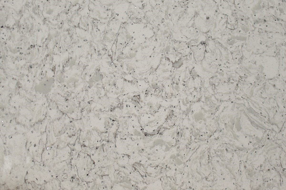 White and gray countertop surface with speckled and marbled patterns.