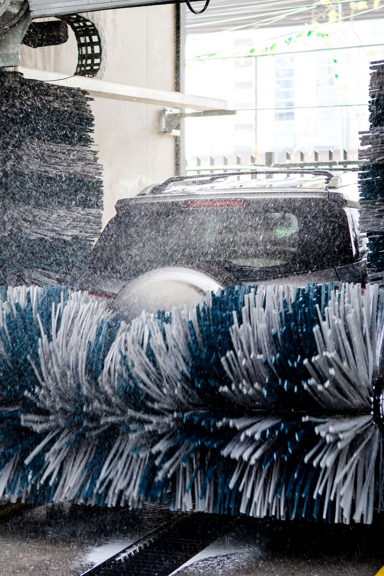 SUV being washed in an automatic car wash