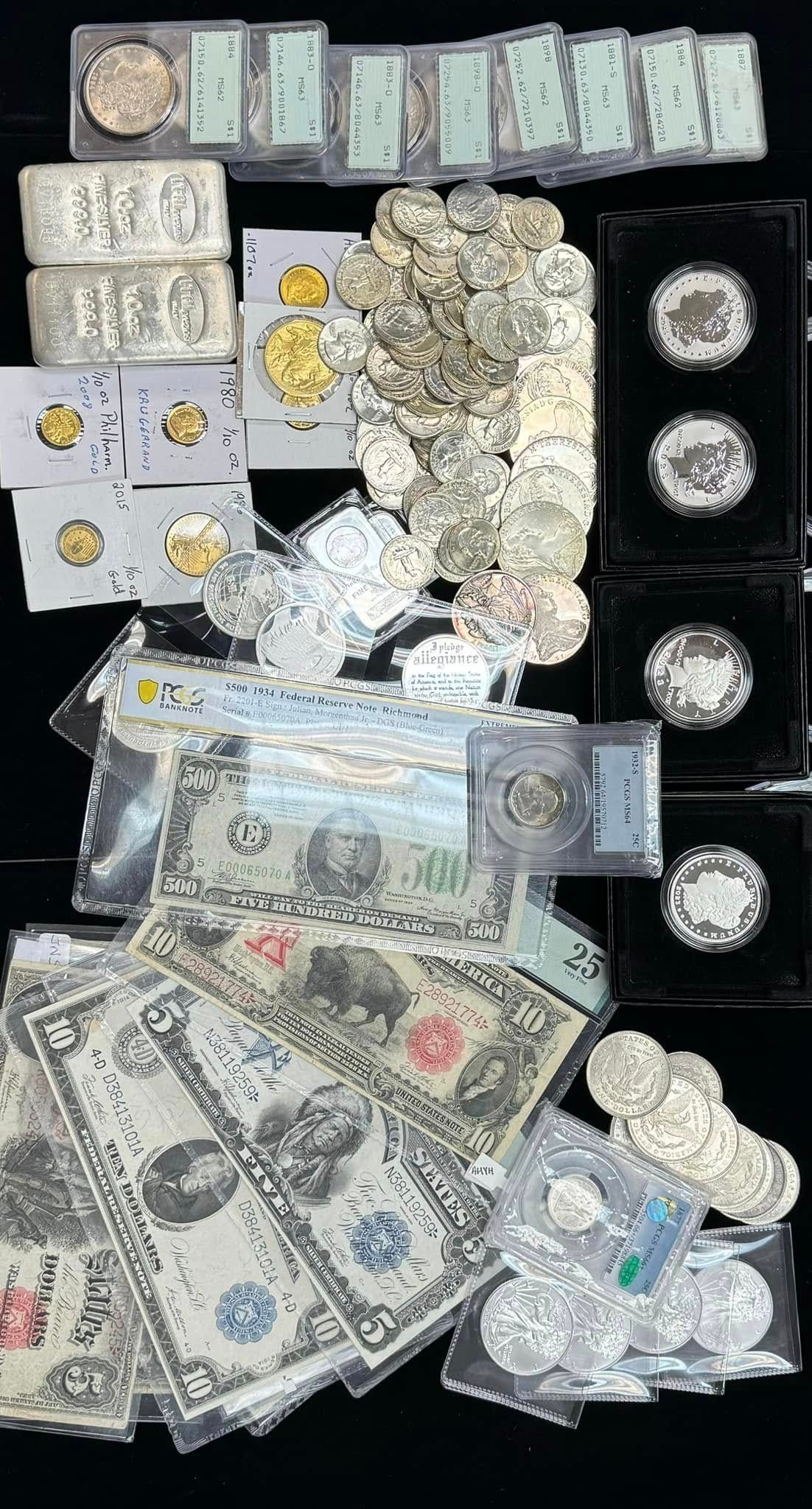 Assorted silver coins and banknotes arranged on a black background