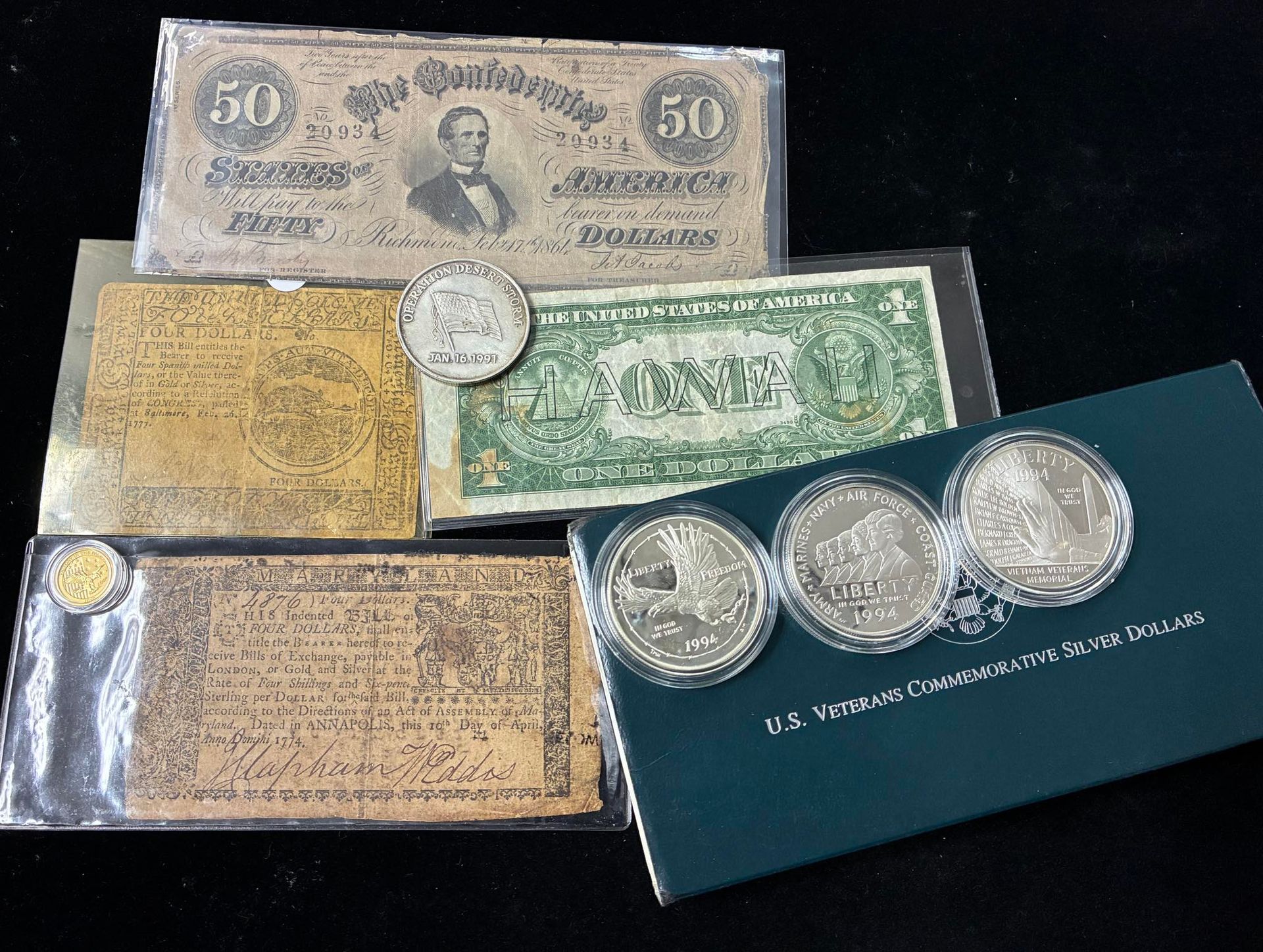 Assorted vintage-looking banknotes and silver coins displayed on a dark background.