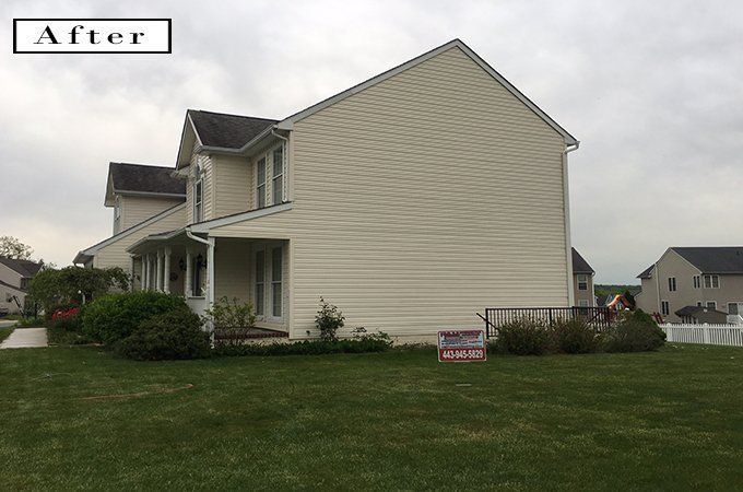 Suburban house with beige siding and green lawn, labeled “After” in the corner.