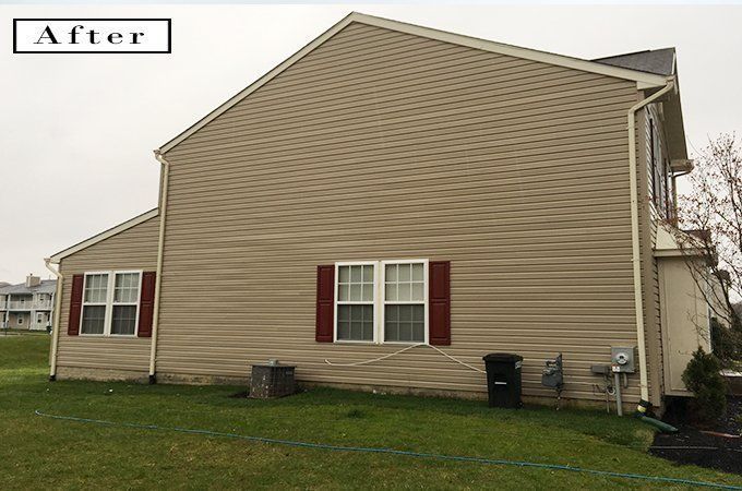 Side view of a beige house with red shutters and a green lawn, labeled “After”