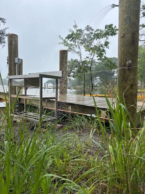A dock is being built next to a body of water.