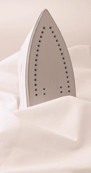 Flat Iron on top of a linen sheet