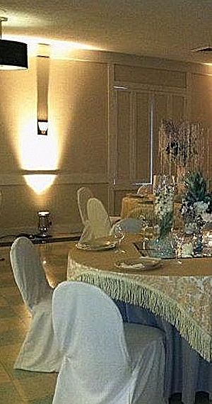 a wedding reception with chairs and tables covered in linen