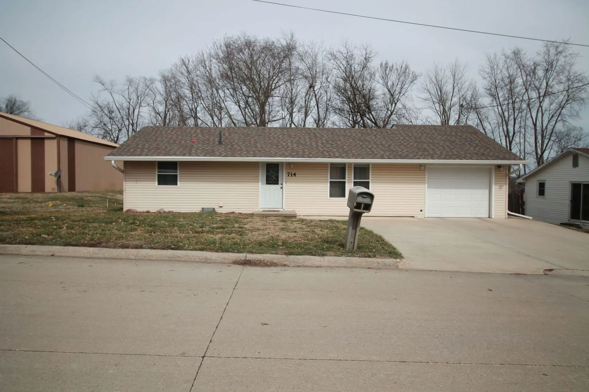 A house with a mailbox in front of it