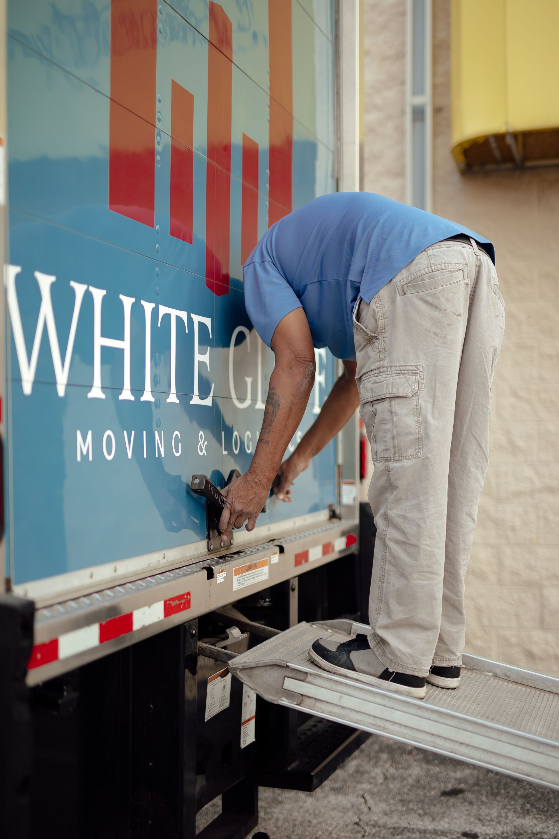 Mover securing cargo on a moving truck lift gate