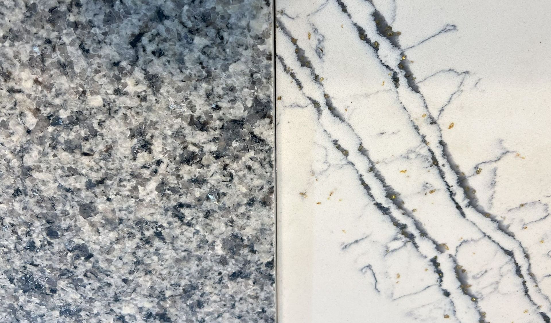 Two stone slabs: one speckled blue-gray, the other white with dark vein-like patterns.