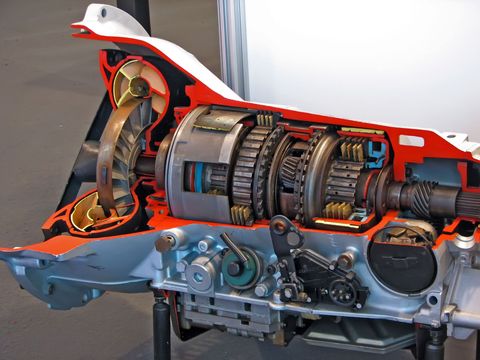 Cutaway of a motor scooter showing the engine, transmission, and frame components in cross-section