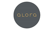 Dark gray circle logo with gold “alora” text