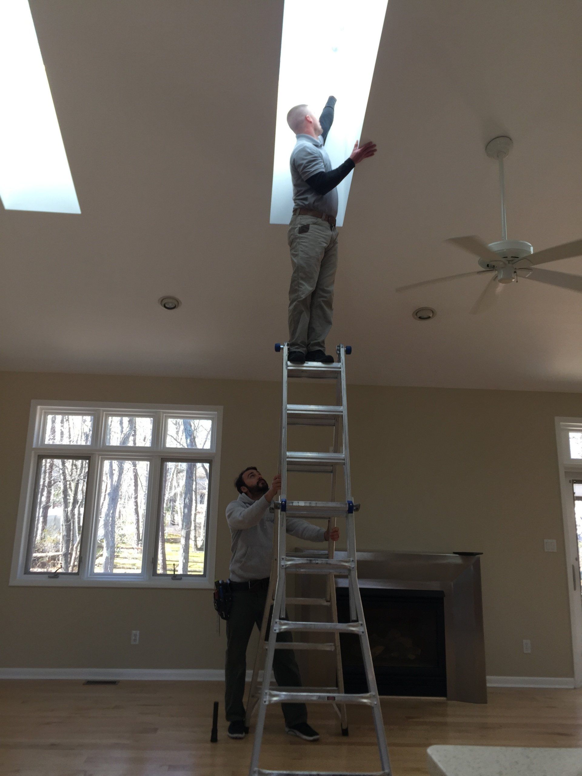 man standing on a ladder