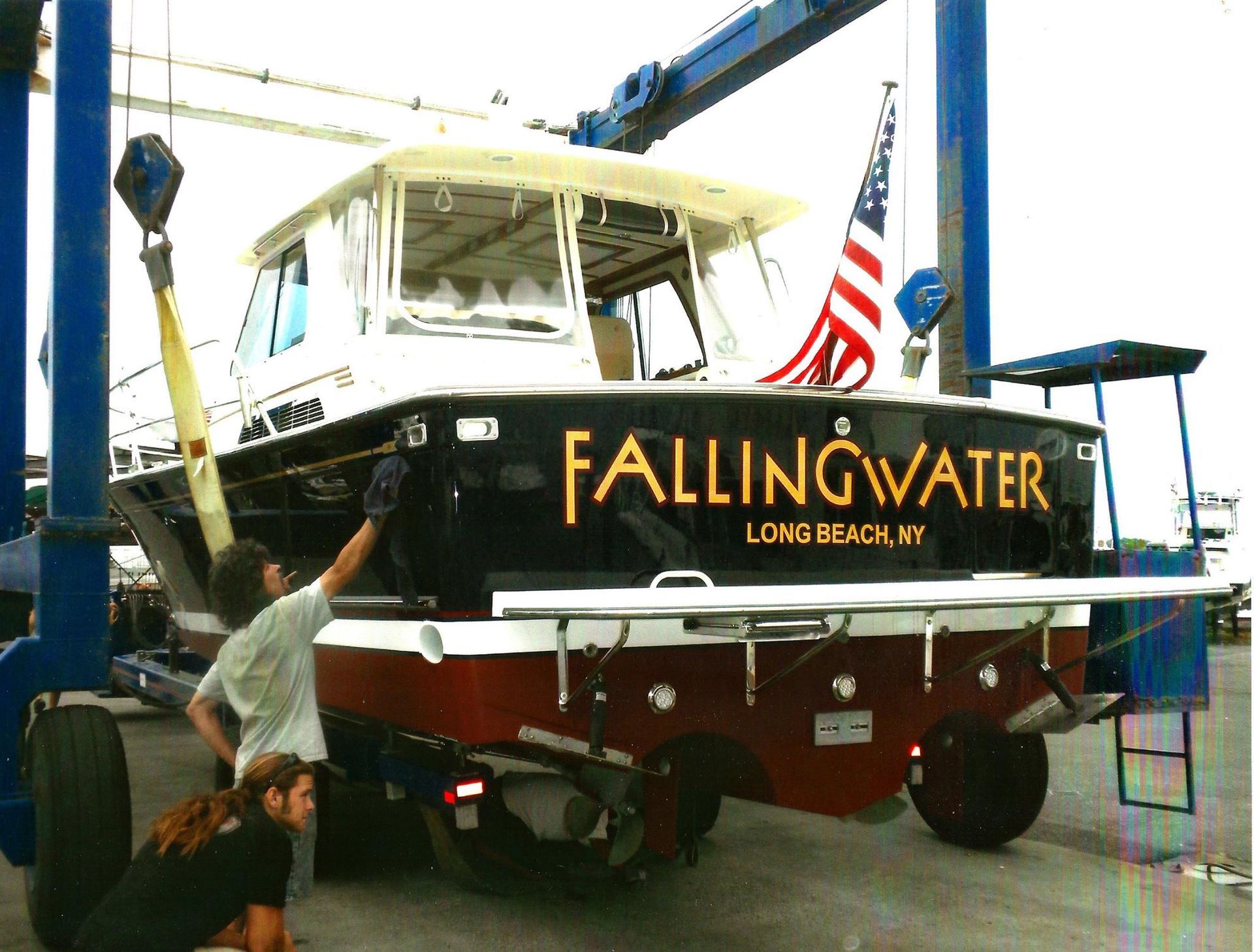 A boat with the name falling water on it