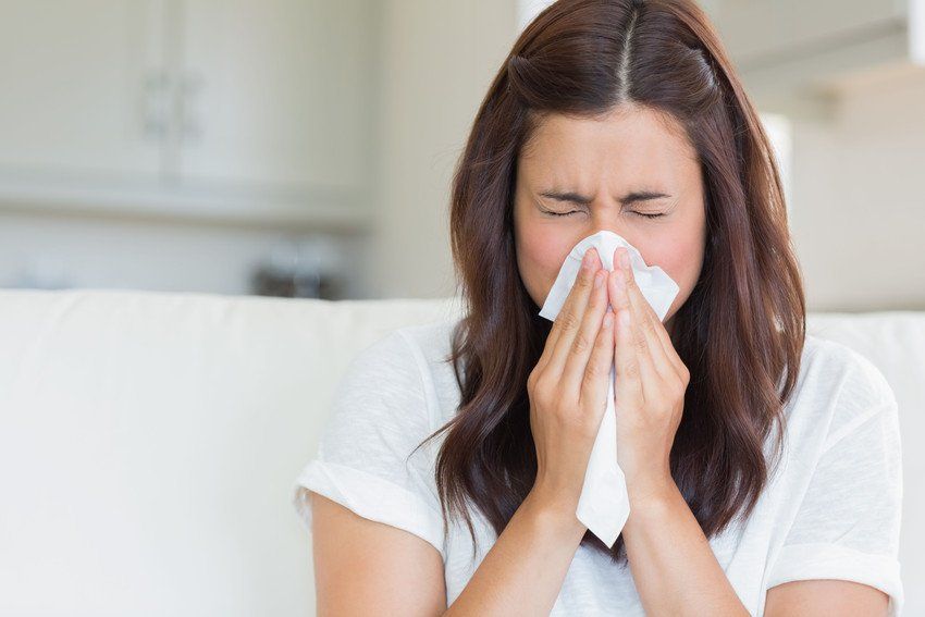 Sneezing woman