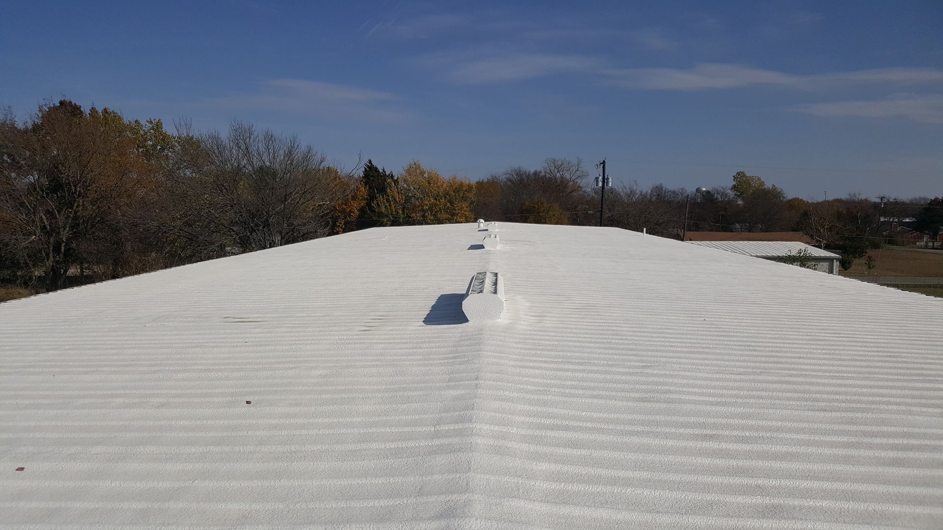 Foam over metal roofing