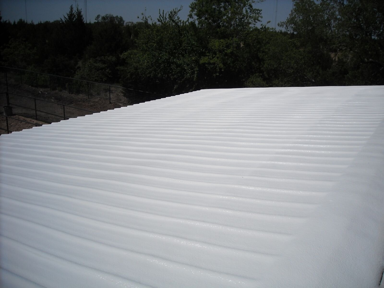 Foam and coating on metal roof