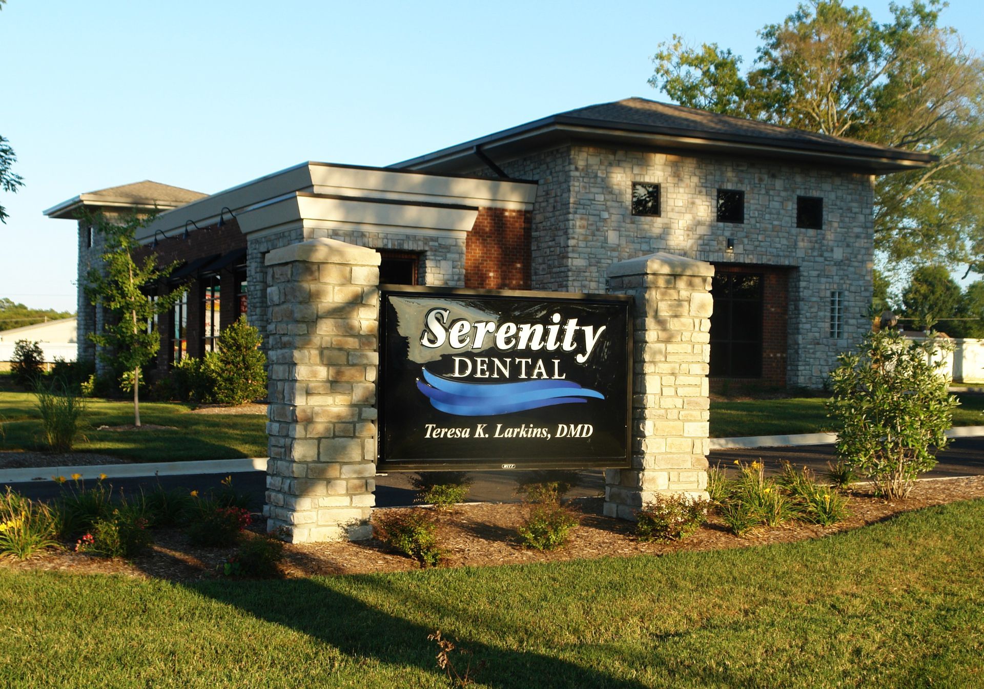 A serenity dental sign in front of a building