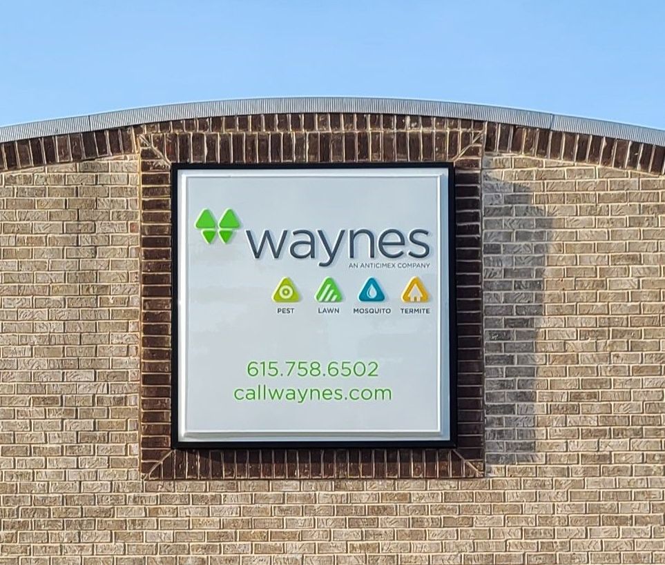 A brick building with a sign that says wayne 's on it