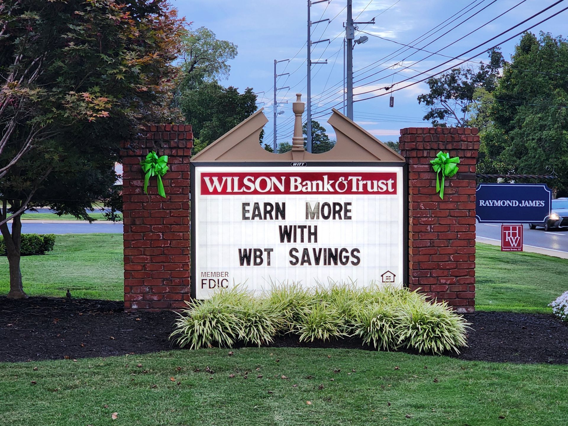 A wilson bank and trust sign that says earn more with wbt savings