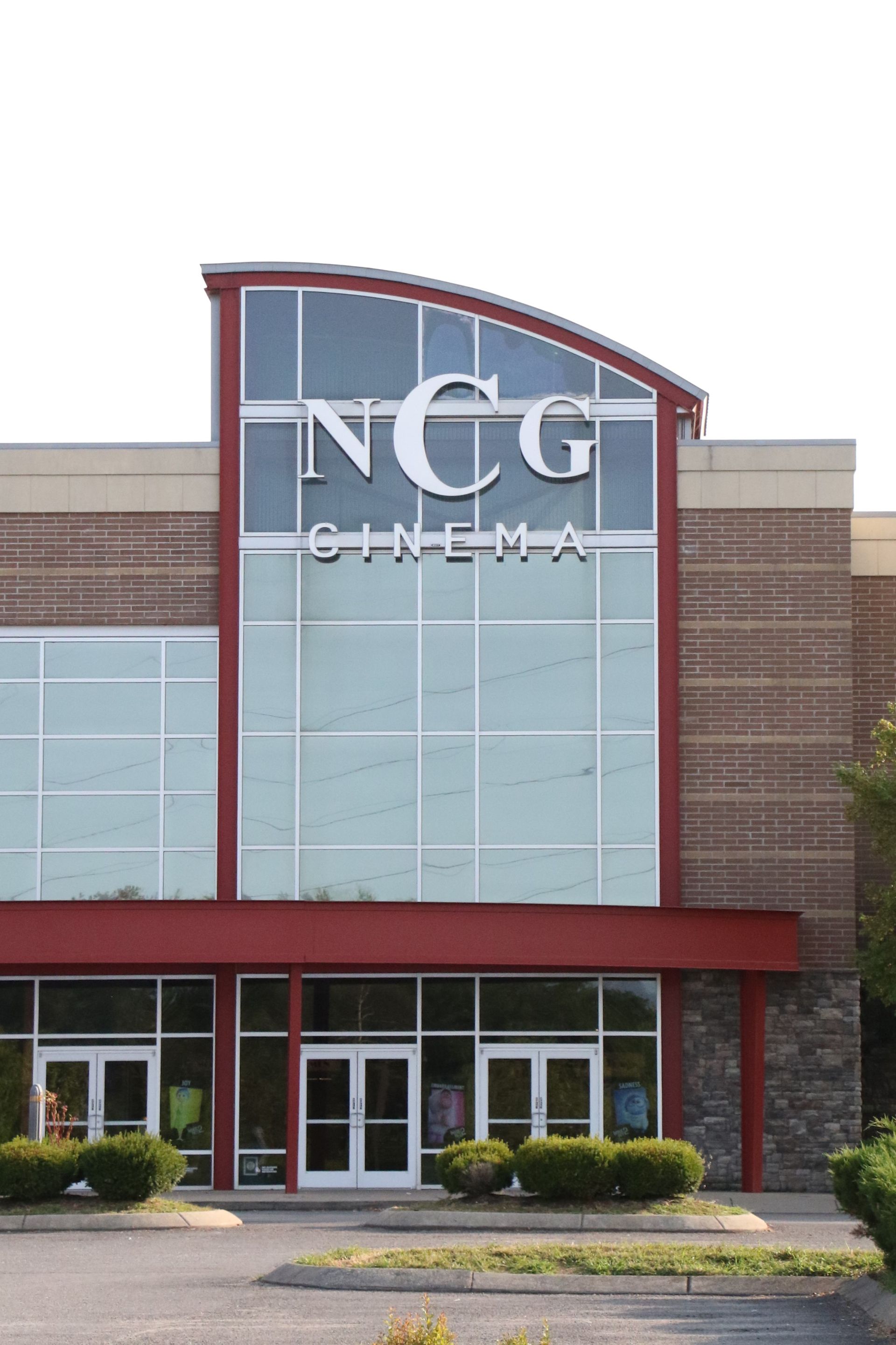 A large building with a sign that says ncg cinema