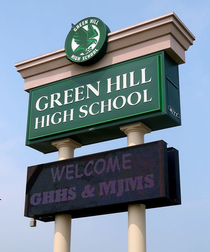 A green hill high school sign with a welcome message
