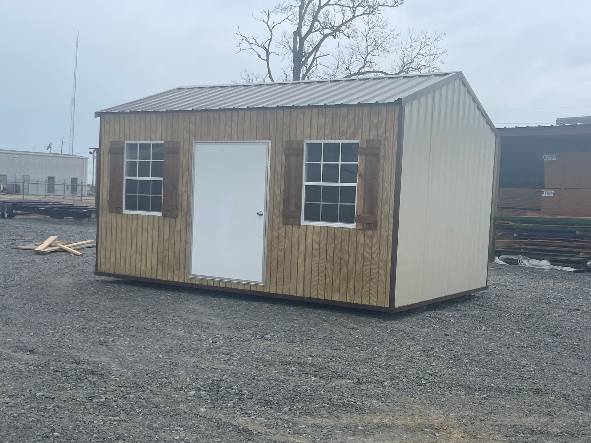 Portable building with wood siding