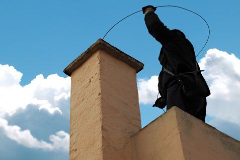 Man sweeping the chimney