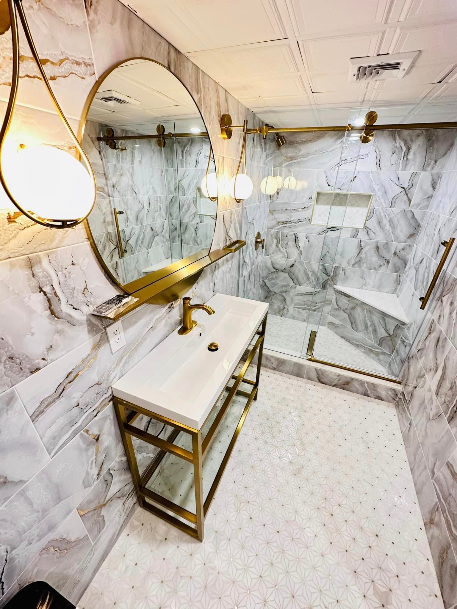 a bathroom with a sink , mirror and shower .