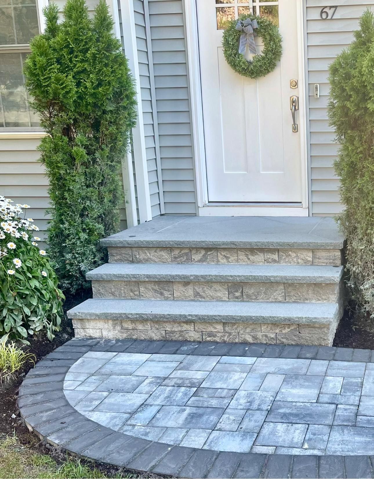 the front door of a house with a wreath on it