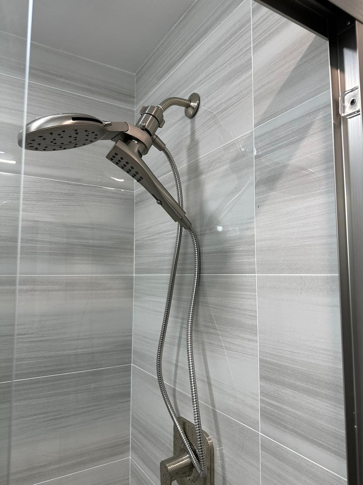 a close up of a shower head in a bathroom .
