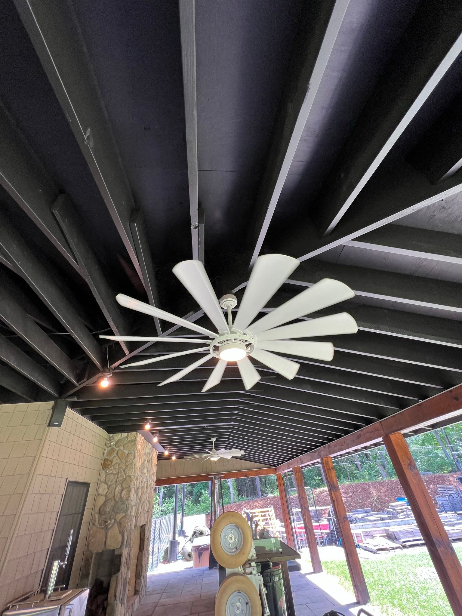 A ceiling fan is hanging from the ceiling of a building.