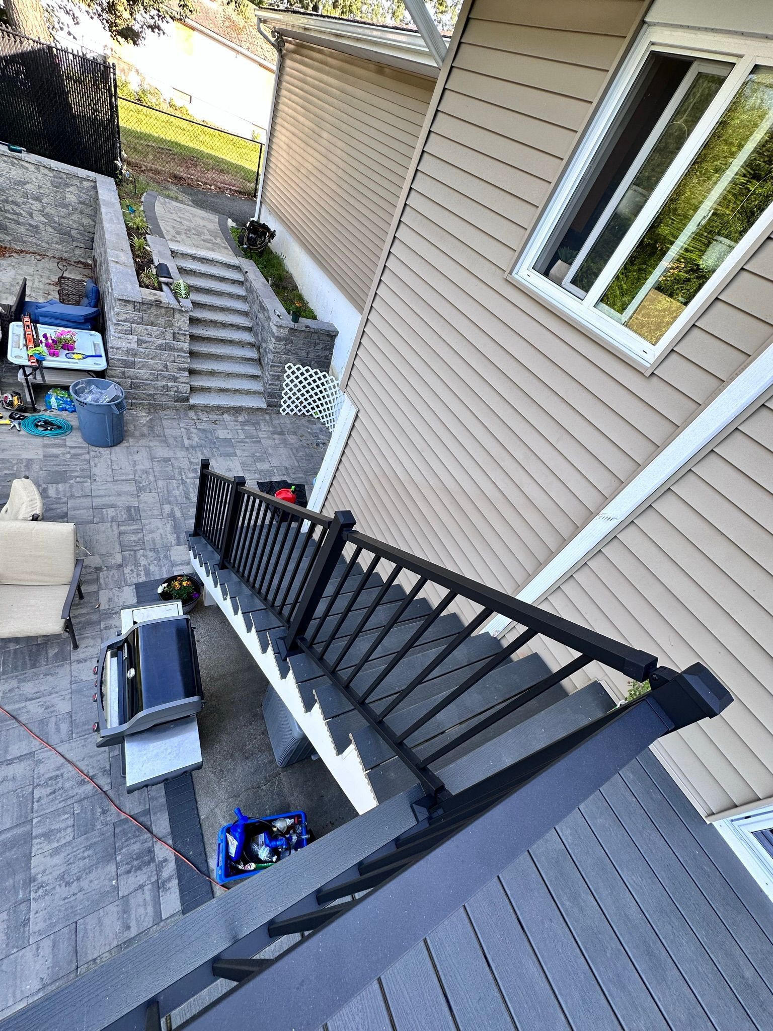 An aerial view of a deck with stairs leading up to a house.