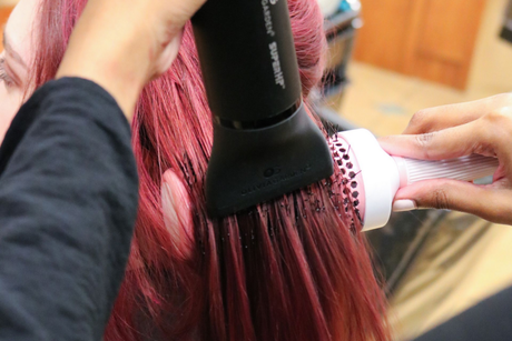 Learn More About Hair Services the back of a woman's head with red and blonde hair