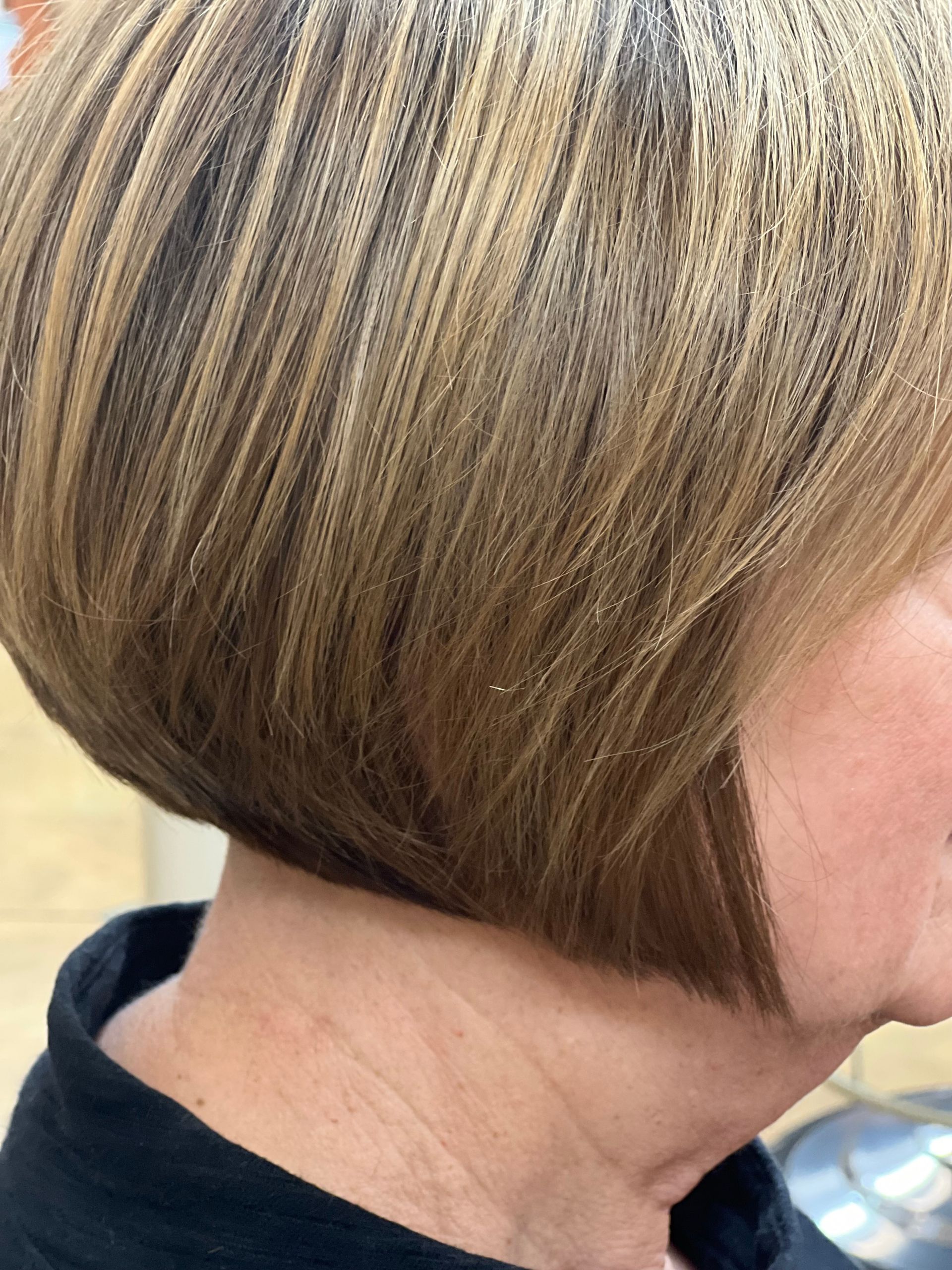 a woman with short blonde hair