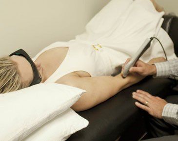 Woman having a laser therapy
