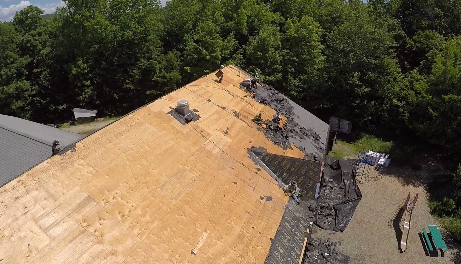An aerial view of a roof being installed on a house.