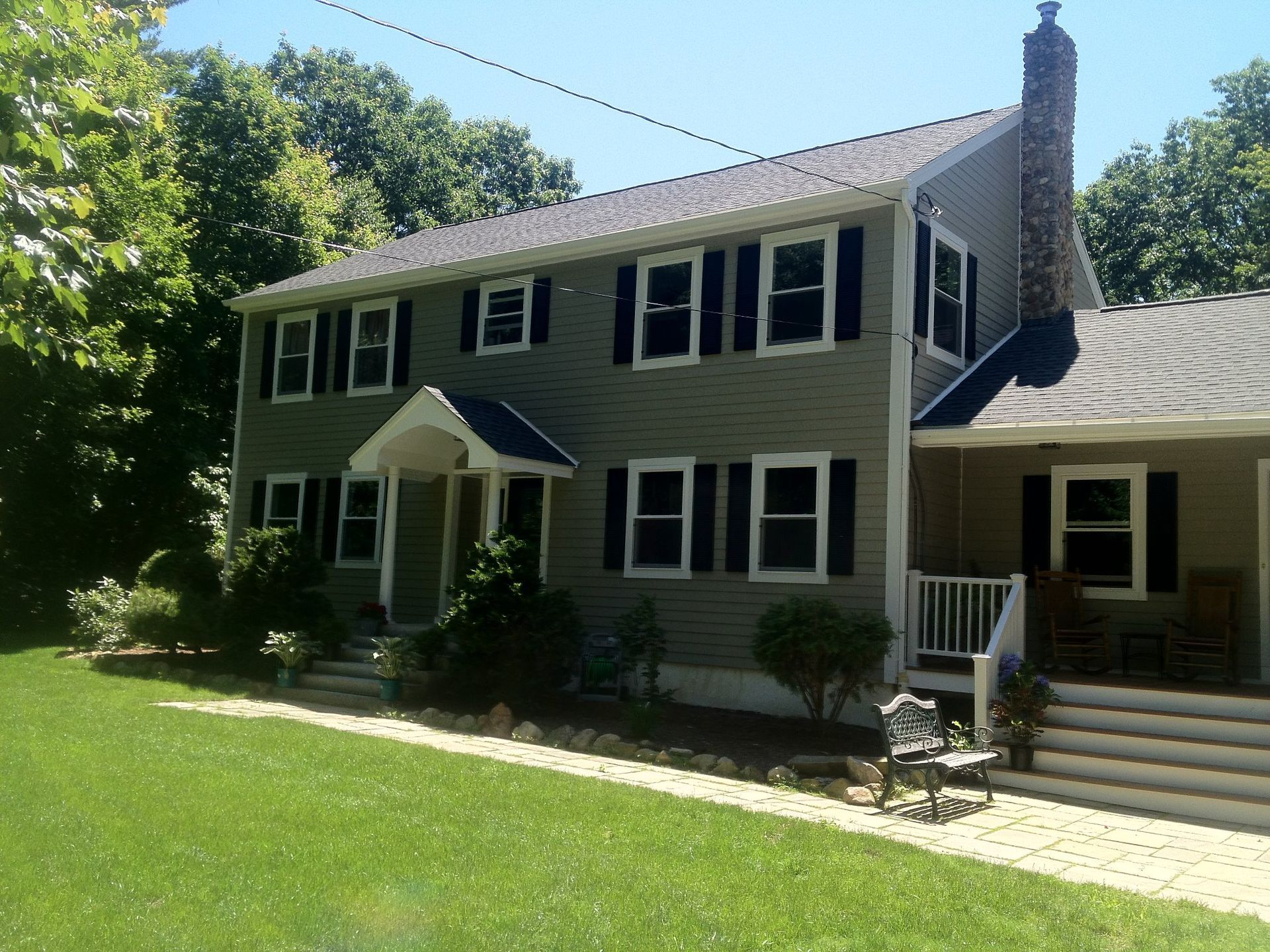 A large house with a lawn in front of it