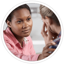 A woman comforting an upset woman